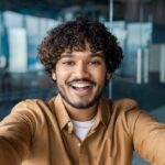 smiling-indian-office-worker-looking-at-camera-tal-2024-02-02-00-50-37-utc.jpg
